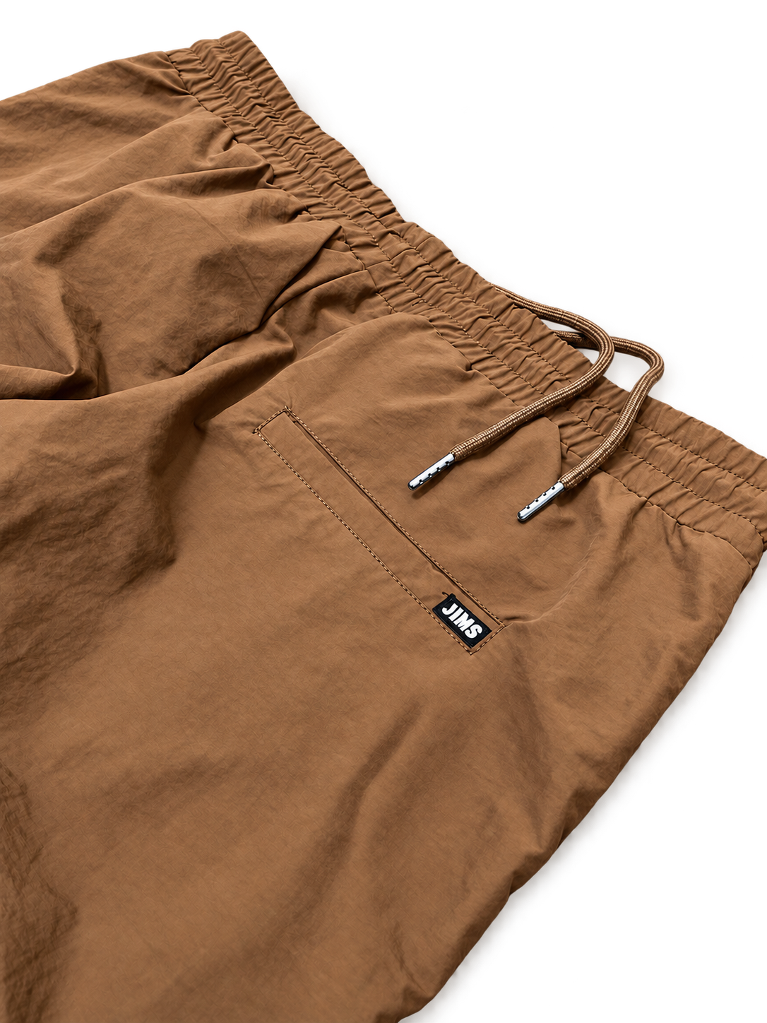 Tan Swish Pants pocket detail transparent background